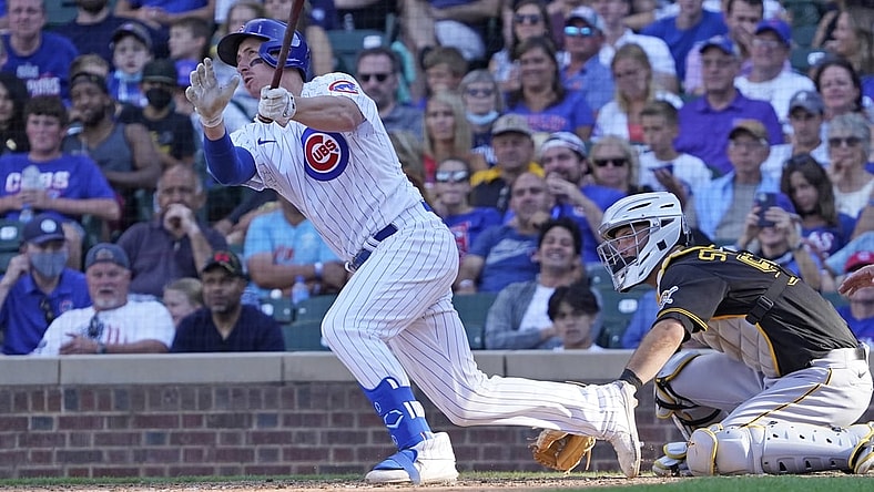 Sep 5, 2021; Chicago, Illinois, USA; Chicago Cubs first baseman Frank Schwindel (18) hits a grand slam home run against the Pittsburgh Pirates during the seventh inning at Wrigley Field. Mandatory Credit: David Banks-USA TODAY Sports