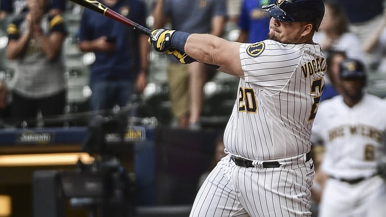 Sep 5, 2021; Milwaukee, Wisconsin, USA;  Milwaukee Brewers first baseman Daniel Vogelbach (20) hits a grand slam home run in the ninth inning to beat the St. Louis Cardinals at American Family Field. Mandatory Credit: Benny Sieu-USA TODAY Sports