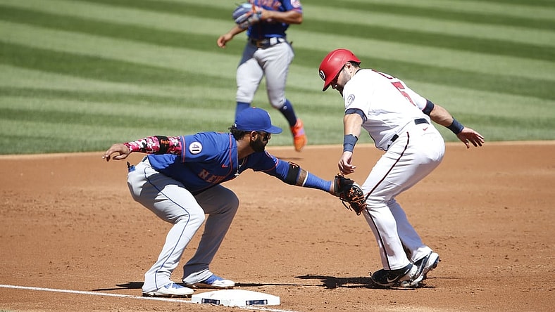 Sep 6, 2021; Washington, District of Columbia, USA; Washington Nationals catcher Alex Avila (6) runs to third base as New York Mets third baseman Jonathan Villar (1) applies a tag for an out in the second inning at Nationals Park. Mandatory Credit: Amber Searls-USA TODAY Sports