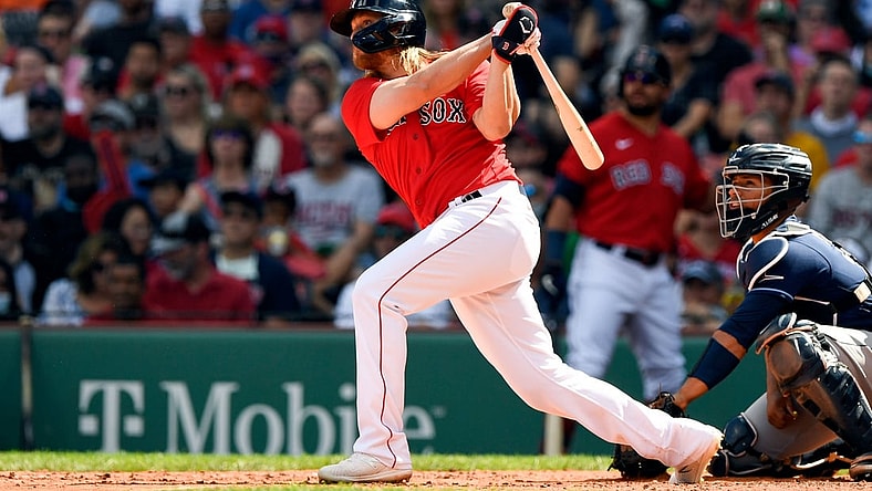 Sep 6, 2021; Boston, Massachusetts, USA; Boston Red Sox shortstop Taylor Motter (30) watches the ball after hitting an RBI double against the Tampa Bay Rays during the second inning at Fenway Park. Mandatory Credit: Brian Fluharty-USA TODAY Sports