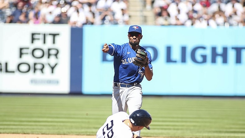 Sep 6, 2021; Bronx, New York, USA;  Toronto Blue Jays second baseman Marcus Semien (10) throws to first to complete a double play in the sixth inning against the New York Yankees at Yankee Stadium. Mandatory Credit: Wendell Cruz-USA TODAY Sports