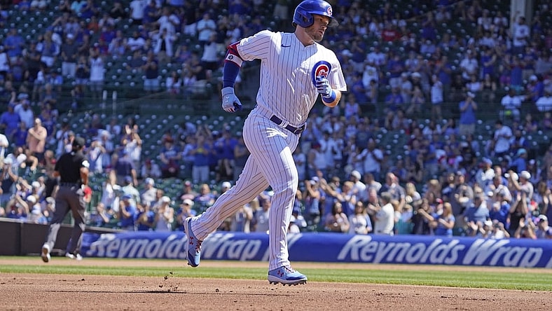 Sep 6, 2021; Chicago, Illinois, USA; Chicago Cubs left fielder Ian Happ (8) runs the bases after hitting a three run home run against the Cincinnati Reds during the first inning at Wrigley Field. Mandatory Credit: David Banks-USA TODAY Sports
