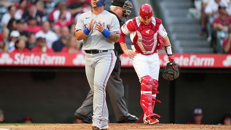 Sep 6, 2021; Anaheim, California, USA; Texas Rangers designated hitter Yohel Pozo (37) reacts after scoring against the Los Angeles Angels in the second inning at Angel Stadium. Mandatory Credit: Kirby Lee-USA TODAY Sports