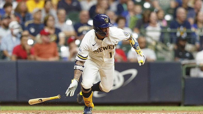Sep 7, 2021; Milwaukee, Wisconsin, USA;  Milwaukee Brewers second baseman Kolten Wong (16) hits a two run single during the sixth inning against the Philadelphia Phillies at American Family Field. Mandatory Credit: Jeff Hanisch-USA TODAY Sports
