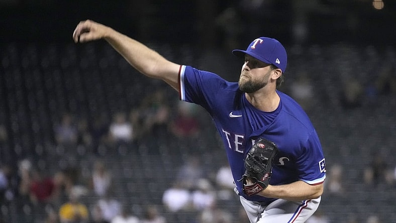 Sep 7, 2021; Phoenix, Arizona, USA; Texas Rangers starting pitcher Jordan Lyles (24) throws against the Arizona Diamondbacks in the first inning at Chase Field. Mandatory Credit: Rick Scuteri-USA TODAY Sports