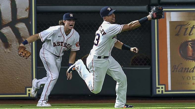 Sep 8, 2021; Houston, Texas, USA; Houston Astros left fielder Michael Brantley (23) and  center fielder Jake Meyers (6) try to field Seattle Mariners center fielder Jarred Kelenic (10) (not pictured) double in the seventh inning at Minute Maid Park. Mandatory Credit: Thomas Shea-USA TODAY Sports