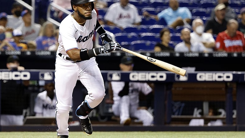 Sep 8, 2021; Miami, Florida, USA; Miami Marlins center fielder Bryan De La Cruz (77) follows through on his double against the New York Mets during the second inning at loanDepot Park Mandatory Credit: Rhona Wise-USA TODAY Sports
