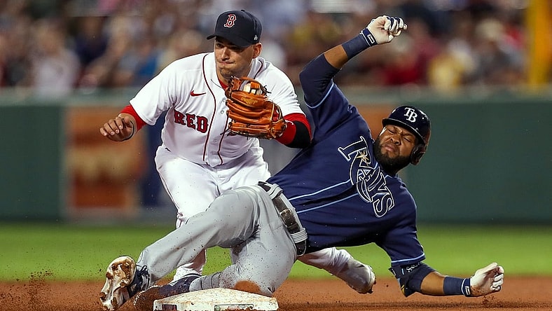 Sep 8, 2021; Boston, Massachusetts, USA; Tampa Bay Rays right fielder Manuel Margot (13) is tagged out at second base by Boston Red Sox shortstop Jose Iglesias (12) during the fourth inning at Fenway Park. Mandatory Credit: Paul Rutherford-USA TODAY Sports