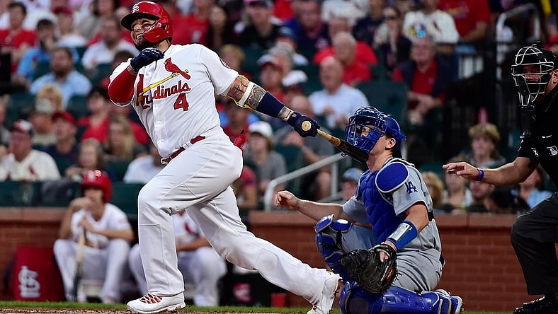 Sep 8, 2021; St. Louis, Missouri, USA;  St. Louis Cardinals catcher Yadier Molina (4) hits a two run home run during the first inning against the Los Angeles Dodgers at Busch Stadium. Mandatory Credit: Jeff Curry-USA TODAY Sports