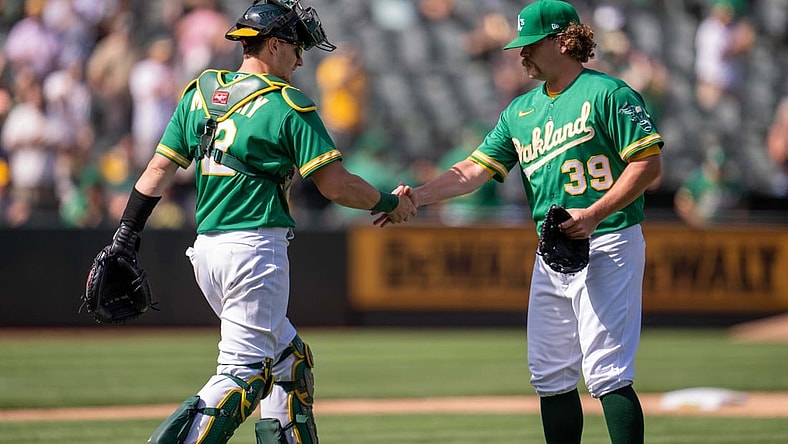 Sep 9, 2021; Oakland, California, USA;  Oakland Athletics relief pitcher Andrew Chafin (39) and Oakland Athletics catcher Sean Murphy (12) celebrate after the end of the game against the Chicago White Sox at RingCentral Coliseum. Mandatory Credit: Neville E. Guard-USA TODAY Sports
