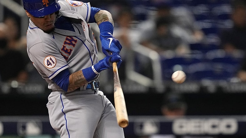 Sep 9, 2021; Miami, Florida, USA; New York Mets second baseman Javier Baez (23) hits a ground rule double in the 1st inning against the Miami Marlins at loanDepot park. Mandatory Credit: Jasen Vinlove-USA TODAY Sports