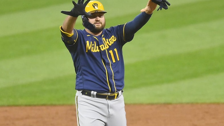 Sep 10, 2021; Cleveland, Ohio, USA; Milwaukee Brewers first baseman Rowdy Tellez (11) celebrates his double in the second inning against the Cleveland Indians at Progressive Field. Mandatory Credit: David Richard-USA TODAY Sports