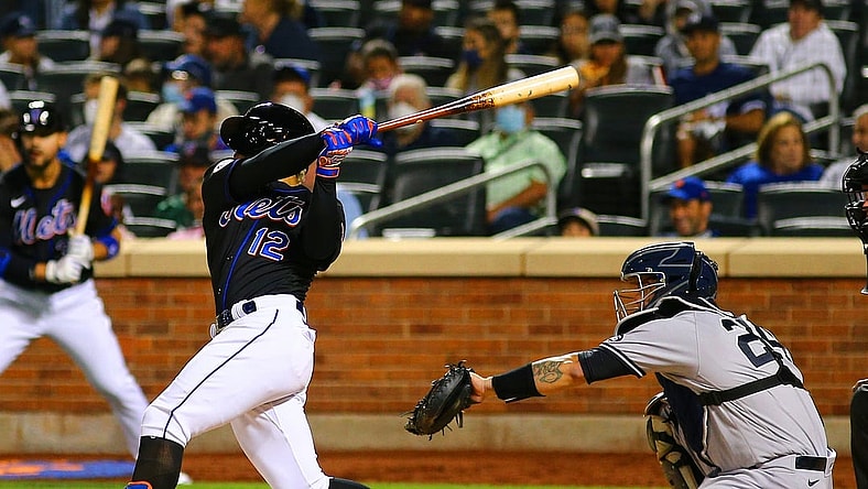 Sep 10, 2021; New York City, New York, USA; New York Mets shortstop Francisco Lindor (12) hits a solo home run against the New York Yankees during the fourth inning at Citi Field. Mandatory Credit: Andy Marlin-USA TODAY Sports