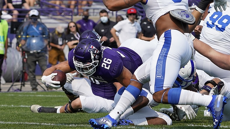 Sep 11, 2021; Evanston, Illinois, USA; Northwestern Wildcats running back Evan Hull (26) scores a touchdown against the Indiana State Sycamores during the first half at Ryan Field. Mandatory Credit: David Banks-USA TODAY Sports