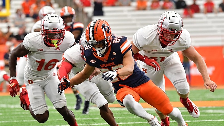 Sep 11, 2021; Syracuse, New York, USA; Syracuse Orange wide receiver Trebor Pena (29) goes to recover a muffed punt return as Rutgers Scarlet Knights defensive back Max Melton (16) and Rutgers Scarlet Knights long snapper Billy Taylor (47) come in during the second quarter at the Carrier Dome. Mandatory Credit: Mark Konezny-USA TODAY Sports
