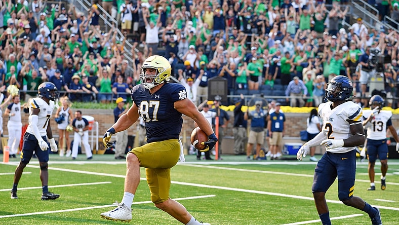 Sep 11, 2021; South Bend, Indiana, USA; Notre Dame Fighting Irish tight end Michael Mayer (87) scores in the fourth quarter against the Toledo Rockets at Notre Dame Stadium. Mandatory Credit: Matt Cashore-USA TODAY Sports