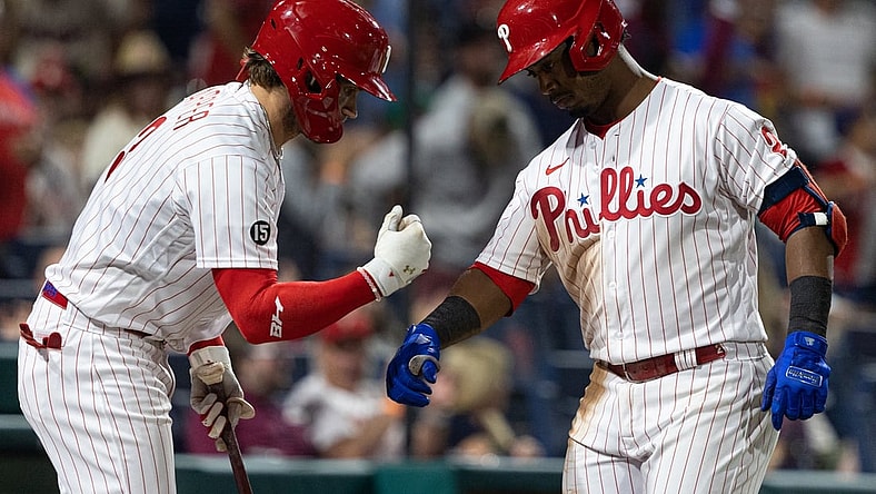 Sep 11, 2021; Philadelphia, Pennsylvania, USA; Philadelphia Phillies shortstop Jean Segura (2) celebrates with right fielder Bryce Harper (left) after hitting a home run against the Colorado Rockies during the fifth inning at Citizens Bank Park. Mandatory Credit: Bill Streicher-USA TODAY Sports