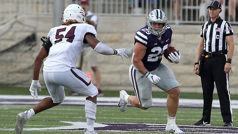 Sep 11, 2021; Manhattan, Kansas, USA; Kansas State Wildcats fullback Jax Dineen (29) looks for room to run against Southern Illinois Salukis linebacker Bryce Notree (54) during a game at Bill Snyder Family Football Stadium. Mandatory Credit: Scott Sewell-USA TODAY Sports