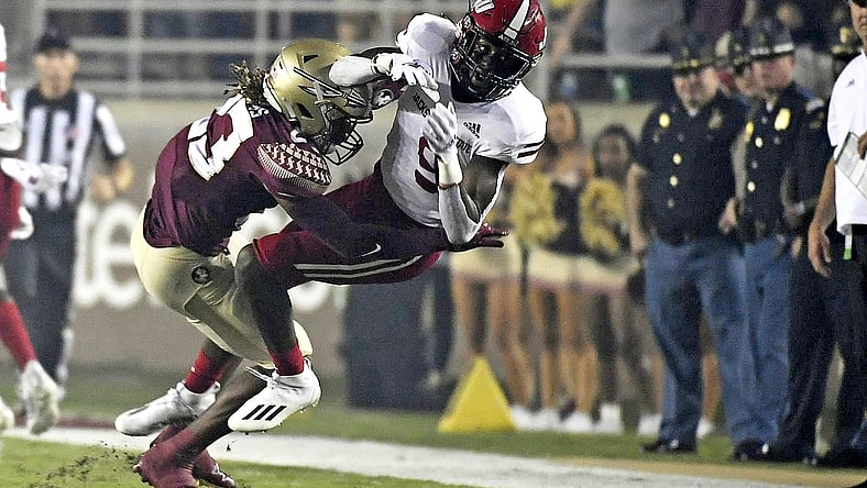 Sep 11, 2021; Tallahassee, Florida, USA; Florida State Seminoles defensive back Sidney Wiliams (23) knocks the ball loose from Jacksonville State Gamecocks wide receiver Ahmad Edwards (9) during the first quarter at Doak S. Campbell Stadium. Mandatory Credit: Melina Myers-USA TODAY Sports