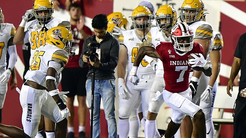 Sep 11, 2021; Bloomington, Indiana, USA; Indiana Hoosiers wide receiver D.J. Matthews Jr. (7) runs the ball to the end zone on a kickoff against the Idaho Vandals during the second quarter at Memorial Stadium. Mandatory Credit: Marc Lebryk-USA TODAY Sports