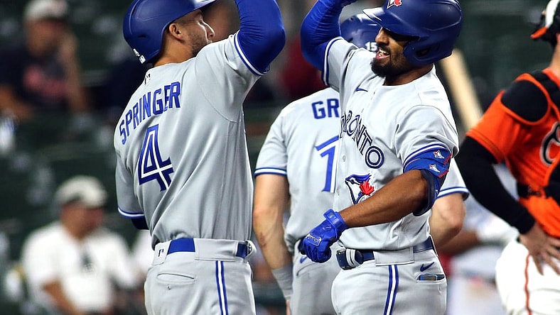 Sept. 11, 2021; Baltimore, Maryland, USA; Toronto Blue Jays shortstop Marcus Semien (10) celebrates with Toronto Blue Jays center fielder George Springer (4) after hitting a home run during the seventh inning against the Baltimore Orioles at Oriole Park at Camden Yards. Mandatory Credit: Daniel Kucin Jr.-USA TODAY Sports