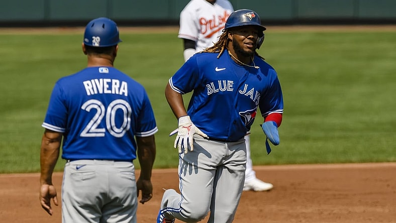 Sep 12, 2021; Baltimore, Maryland, USA;  Toronto Blue Jays designated hitter Vladimir Guerrero Jr. (27) runs to home plate on a home run by right fielder Teoscar Hernandez (not pictured) during the third inning at Oriole Park at Camden Yards. Mandatory Credit: James A. Pittman-USA TODAY Sports