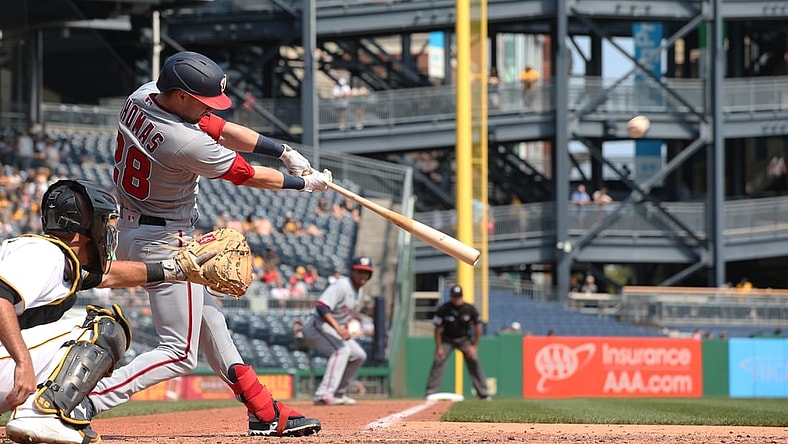 Sep 12, 2021; Pittsburgh, Pennsylvania, USA;  Washington Nationals center fielder Lane Thomas (28) hits a three run home run against the Pittsburgh Pirates during the fourth inning at PNC Park. Mandatory Credit: Charles LeClaire-USA TODAY Sports