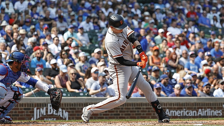Sep 12, 2021; Chicago, Illinois, USA; San Francisco Giants second baseman Wilmer Flores (41) hits an RBI-single against the Chicago Cubs during the second inning at Wrigley Field. Mandatory Credit: Kamil Krzaczynski-USA TODAY Sports