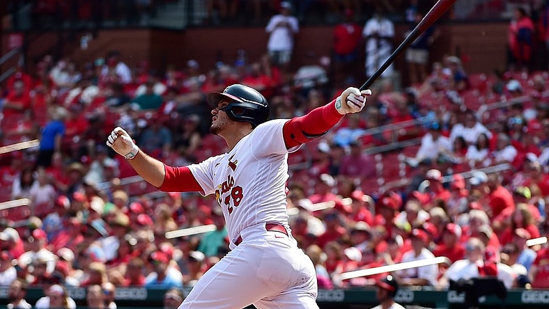 Sep 12, 2021; St. Louis, Missouri, USA;  St. Louis Cardinals third baseman Nolan Arenado (28) hits a two run home run during the first inning against the Cincinnati Reds at Busch Stadium. Mandatory Credit: Jeff Curry-USA TODAY Sports