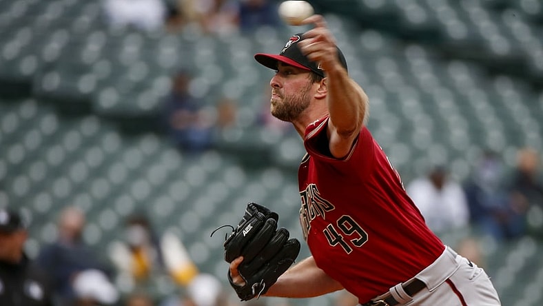 Sep 12, 2021; Seattle, Washington, USA; Arizona Diamondbacks starting pitcher Tyler Gilbert (49) throws against the Seattle Mariners during the first inning at T-Mobile Park. Mandatory Credit: Joe Nicholson-USA TODAY Sports