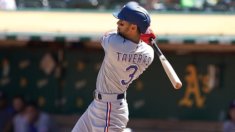 Sep 12, 2021; Oakland, California, USA; Texas Rangers center fielder Leody Taveras (3) hits an RBI triple during the fourth inning against the Oakland Athletics at RingCentral Coliseum. Mandatory Credit: Darren Yamashita-USA TODAY Sports