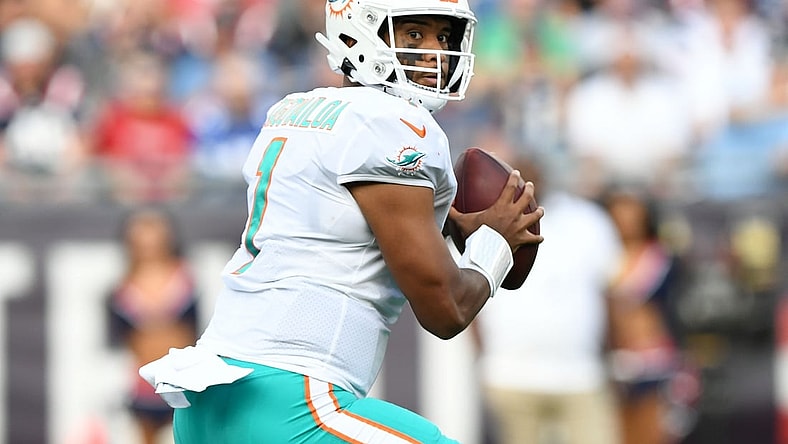 Sep 12, 2021; Foxborough, Massachusetts, USA; Miami Dolphins quarterback Tua Tagovailoa (1) looks to pass against the New England Patriots during the first half at Gillette Stadium. Mandatory Credit: Brian Fluharty-USA TODAY Sports