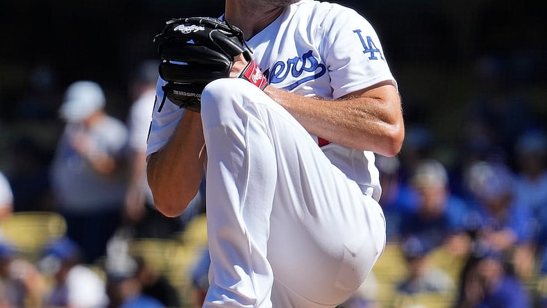 Sep 12, 2021; Los Angeles, California, USA; Los Angeles Dodgers starting pitcher Max Scherzer (31) winds up to throw a pitch in the fourth inning against the San Diego Padres at Dodger Stadium. Mandatory Credit: Robert Hanashiro-USA TODAY Sports