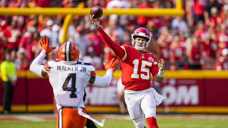Sep 12, 2021; Kansas City, Missouri, USA; Kansas City Chiefs quarterback Patrick Mahomes (15) throws a pass as Cleveland Browns middle linebacker Anthony Walker (4) defends during the first half at GEHA Field at Arrowhead Stadium. Mandatory Credit: Jay Biggerstaff-USA TODAY Sports
