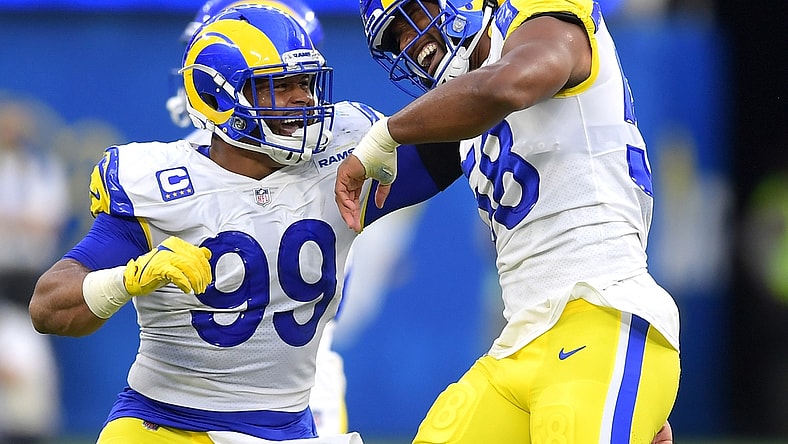 Sep 12, 2021; Inglewood, California, USA;  Los Angeles Rams defensive end Aaron Donald (99) celebrates with linebacker Justin Hollins (58) after he forced a fumble against the Chicago Bears in the first half of the game at SoFi Stadium. Mandatory Credit: Jayne Kamin-Oncea-USA TODAY Sports