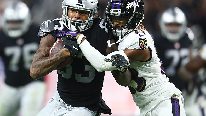 Sep 13, 2021; Paradise, Nevada, USA; Las Vegas Raiders tight end Darren Waller (83) runs the ball against Baltimore Ravens cornerback Anthony Averett (23) during the second half at Allegiant Stadium. Mandatory Credit: Mark J. Rebilas-USA TODAY Sports