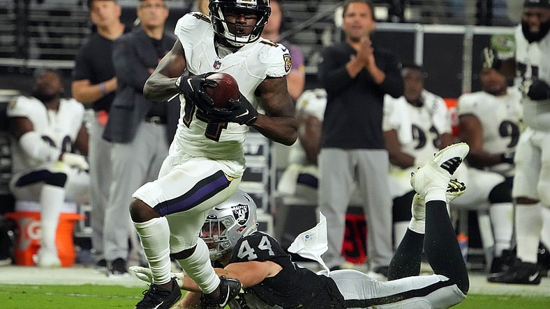 Sep 13, 2021; Paradise, Nevada, USA; Baltimore Ravens wide receiver Sammy Watkins (14) runs the ball ahead of Las Vegas Raiders inside linebacker Nick Kwiatkoski (44) during the second half at Allegiant Stadium. Mandatory Credit: Kirby Lee-USA TODAY Sports