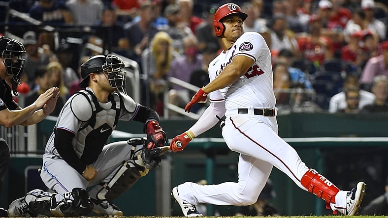 Sep 14, 2021; Washington, District of Columbia, USA; Washington Nationals right fielder Juan Soto (22) hits an RBI single against the Miami Marlins during the third inning at Nationals Park. Mandatory Credit: Brad Mills-USA TODAY Sports