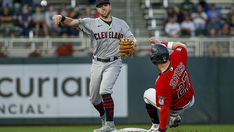 Sep 14, 2021; Minneapolis, Minnesota, USA; Cleveland Indians second baseman Owen Miller (6) forces out Minnesota Twins catcher Ryan Jeffers (27) and turns a double play in the second inning at Target Field. Mandatory Credit: Bruce Kluckhohn-USA TODAY Sports