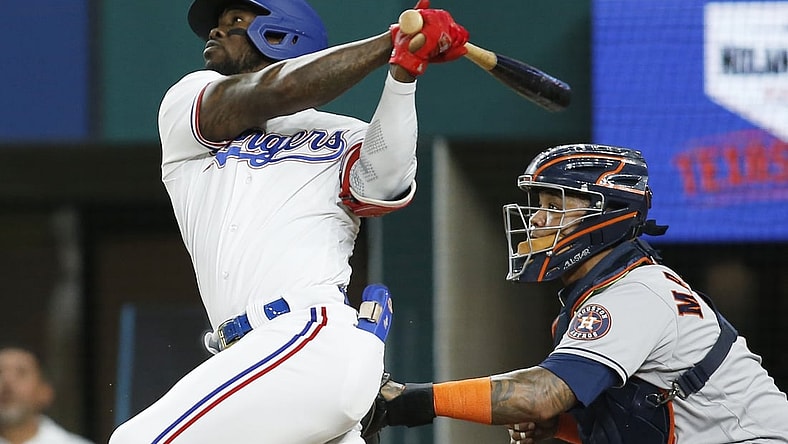 Sep 14, 2021; Arlington, Texas, USA; Texas Rangers right fielder Adolis Garcia (53) hits a home run in the third inning against the Houston Astros at Globe Life Field. Mandatory Credit: Tim Heitman-USA TODAY Sports