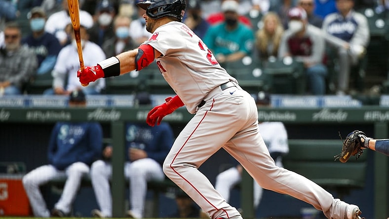 Sep 15, 2021; Seattle, Washington, USA; Boston Red Sox catcher Kevin Plawecki (25) hits an RBI-fielders choice against the Seattle Mariners during the second inning at T-Mobile Park. Mandatory Credit: Joe Nicholson-USA TODAY Sports