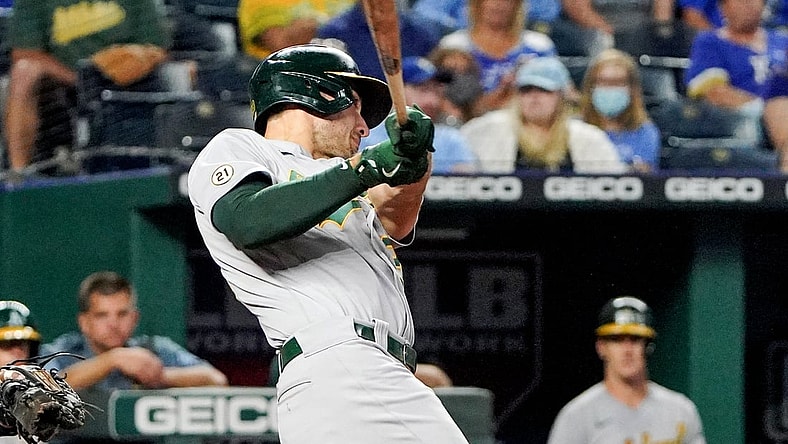 Sep 15, 2021; Kansas City, Missouri, USA; Oakland Athletics first baseman Matt Olson (28) hits a two run home run against the Kansas City Royals in the fourth inning at Kauffman Stadium. Mandatory Credit: Denny Medley-USA TODAY Sports