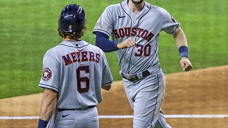 Sep 15, 2021; Arlington, Texas, USA;  Houston Astros right fielder Kyle Tucker (30) celebrates with center fielder Jake Meyers (6) after hitting a home run during the eighth inning against the Texas Rangers at Globe Life Field. Mandatory Credit: Kevin Jairaj-USA TODAY Sports