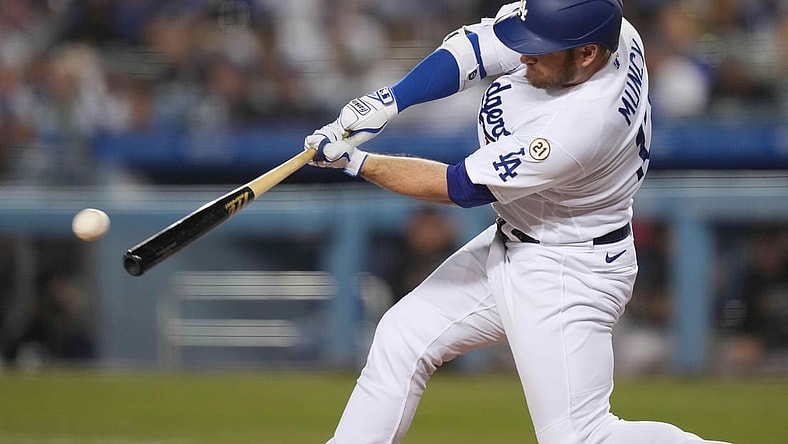 Sep 15, 2021; Los Angeles, California, USA; Los Angeles Dodgers first baseman Max Muncy (13) follows through on a single in the third inning against the Arizona Diamondbacks at Dodger Stadium. Mandatory Credit: Kirby Lee-USA TODAY Sports