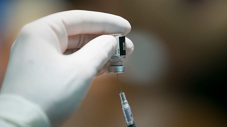 Pharmacist Tim Sage assembles a dose of the Pfizer-BioNTech COVID-19 vaccine at SwedishAmerican hospital on Thursday, Dec. 17, 2020, in Rockford.COVID-19 Vaccine