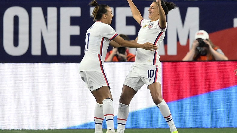 Sep 16, 2021; Cleveland, Ohio, USA; USA forward Carli Lloyd (10) celebrates with forward Mallory Pugh (11) after scoring her first goal against Paraguay in the first half of an international friendly soccer match at FirstEnergy Stadium. Mandatory Credit: David Richard-USA TODAY Sports