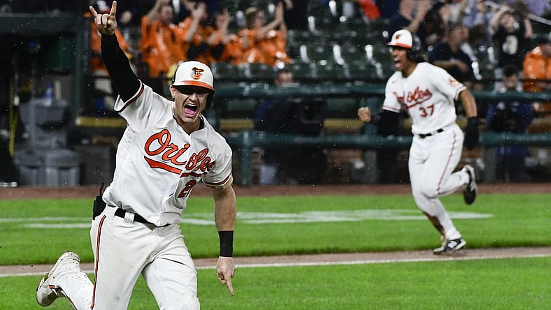 Sep 16, 2021; Baltimore, Maryland, USA;  Baltimore Orioles outfielder Austin Hayes hits a game winning single scoring second baseman Jahmai Jones during the tenth inning against the New York Yankeesat Oriole Park at Camden Yards. Mandatory Credit: Tommy Gilligan-USA TODAY Sports