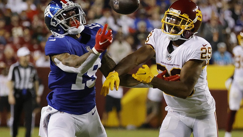 Sep 16, 2021; Landover, Maryland, USA; New York Giants wide receiver Kenny Golladay (19) attempts to make a catch as Washington Football Team cornerback Kendall Fuller (29) defends in the third quarter at FedExField. Mandatory Credit: Geoff Burke-USA TODAY Sports