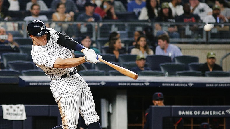 Sep 17, 2021; Bronx, New York, USA; New York Yankees right fielder Aaron Judge (99) hits a solo home run against the Cleveland Indians during the fourth inning at Yankee Stadium. Mandatory Credit: Andy Marlin-USA TODAY Sports