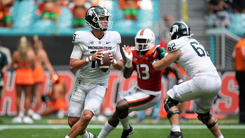 Sep 18, 2021; Miami Gardens, Florida, USA; Michigan State Spartans quarterback Payton Thorne (10) drops back before attempting a pass during the first half against the Miami Hurricanes at Hard Rock Stadium. Mandatory Credit: Jasen Vinlove-USA TODAY Sports